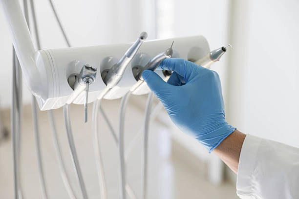 Professional Tooth Extraction technician working in Charles City, IA